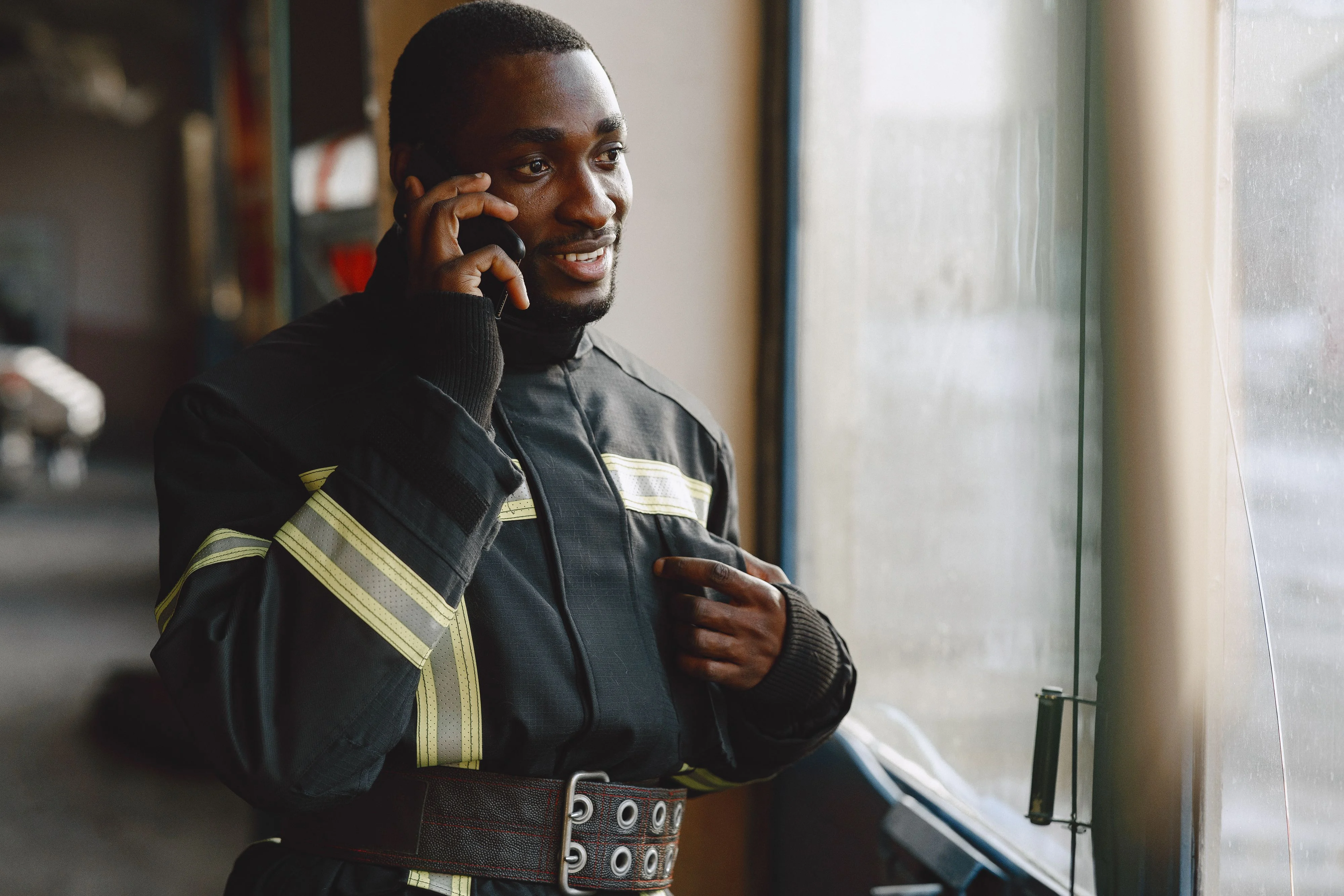 First responder in uniform inside an emergency vehicle